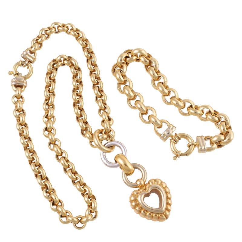 Combinazione di gioielli in oro giallo e oro bianco, contenente girocollo con pendente a cuore e ...