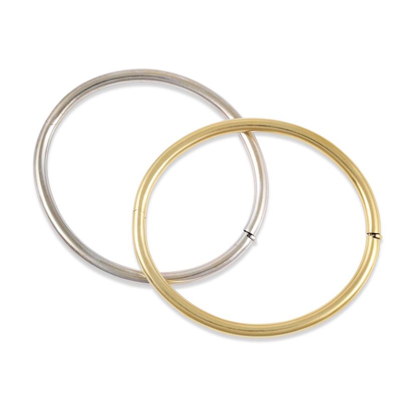 Due bracciali rigidi in oro bianco e giallo 18Kt