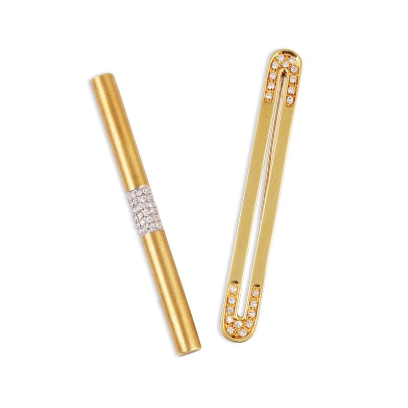 Due spille a barretta in oro giallo 18Kt con diamanti