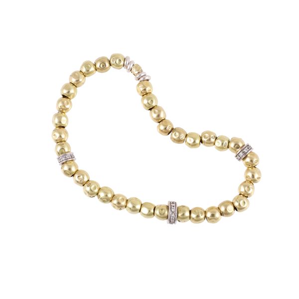 STRETCH BRACELET WITH 18 KT GOLD "DoDo" BY POMELLATO BEADS, WHITE-GOLD RONDELLES WITH DIAMONDS AND SILVER COMPONENTS