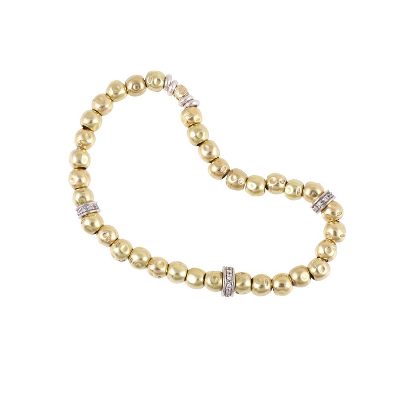 Pomellato, Bracciale elastico 'DoDo' in oro giallo e bianco con brillanti