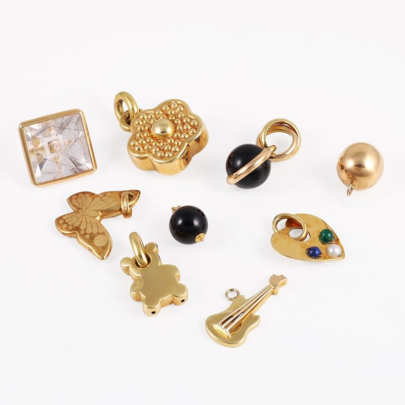Pendenti in oro con boule in onice e quarzo rutilato