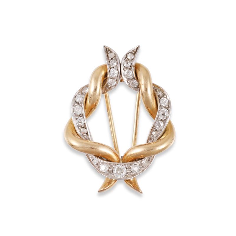 Spilla in oro giallo 18Kt e platino con diamanti europei