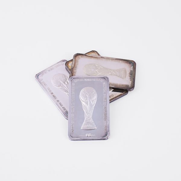 LOT COMPRISING FOUR OFFICIAL FIFA 1982 SILVER INGOTS, 999/1000