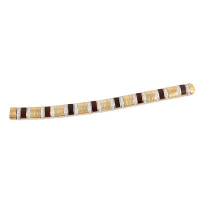 Bracciale in oro giallo e bianco 18Kt con brillanti e granati