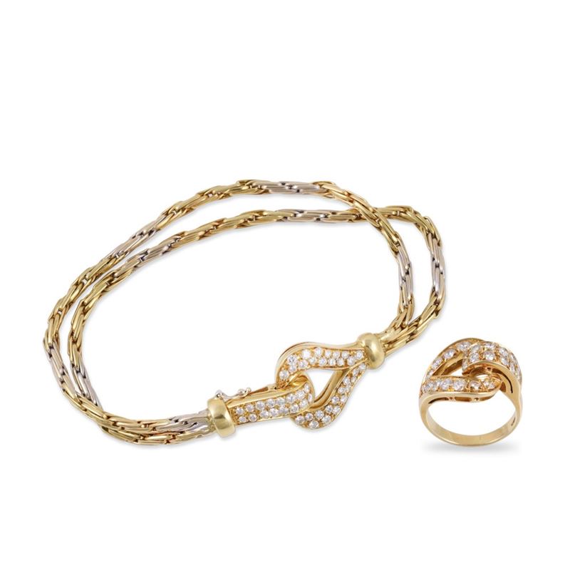 Parure in oro giallo e bianco 18Kt con bracciale a doppia catena e anello coordinato