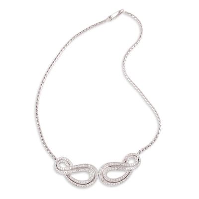 Girocollo in oro bianco 18Kt con motivo a volute in diamanti