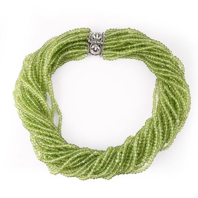 Girocollo, torchon con rondelle sfaccettate in peridoto e chiusura in oro bianco 18 Kt con smeral...