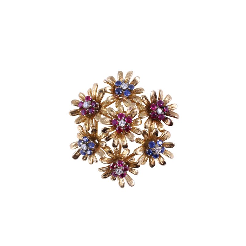 Spilla circolare in oro giallo 18 kt con diamanti, rubini e zaffiri