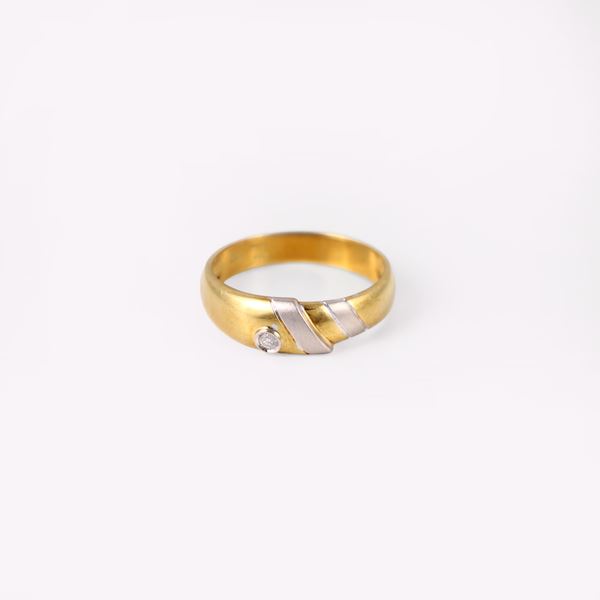 18KT GOLD RING SET WITH A DIAMOND, BY DAMIANI