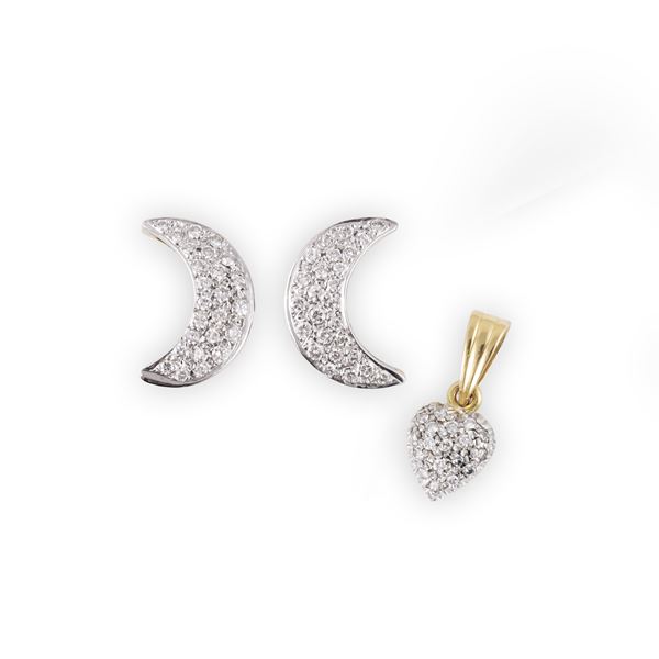 18KT GOLD LOT COMPRISING A PAIR OF EARRINGS AND A PENDANT SET WITH DIAMONDS