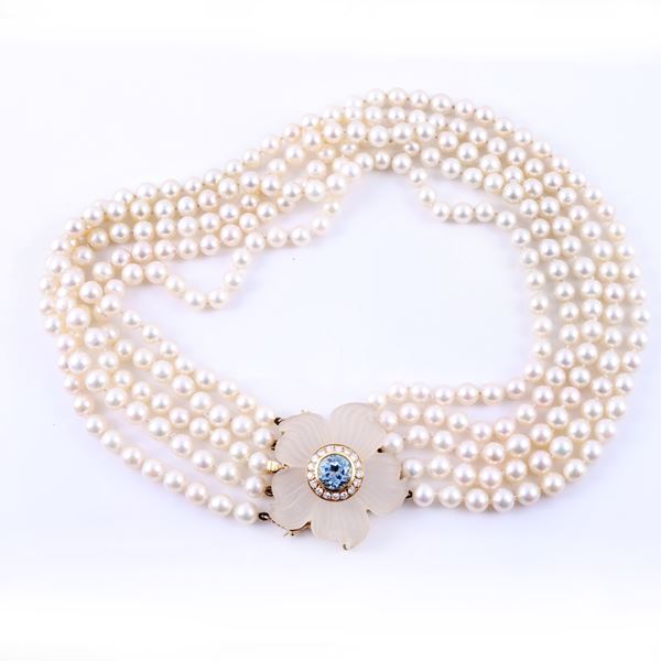 A FIVE-STRAND CULTURED PEARL NECKLACE WITH AN 18KT GOLD CLASP SET WITH DIAMONDS AND BLUE TOPAZ