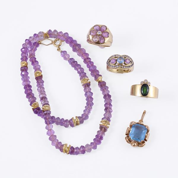 Comprising three rings, one set with a green tourmaline and small brilliant-cut diamonds, two set with synthetic stones, a pendant set with a synthetic stone, and an amethyst faceted rondelle necklace
