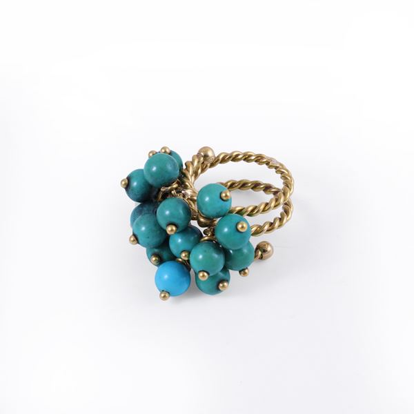18KT GOLD RING SET WITH TURQUOISE BEADS (ONE IN PASTE OF TURQUOISE)