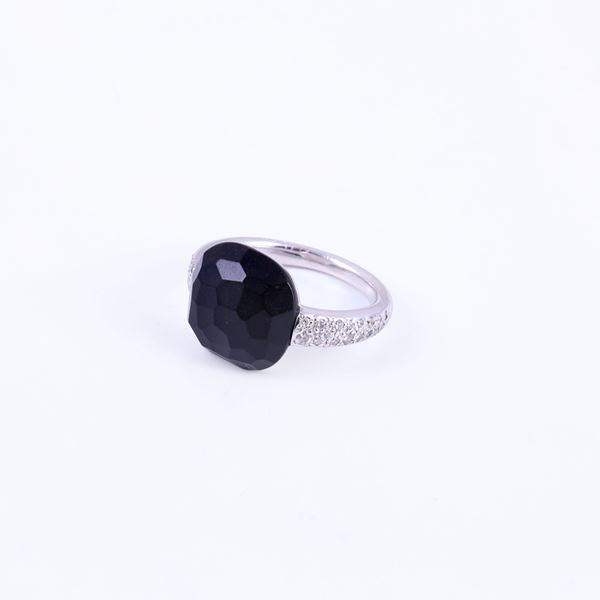 * 18KT GOLD RING SET WITH JET AND DIAMONDS, BY POMELLATO "Capri"