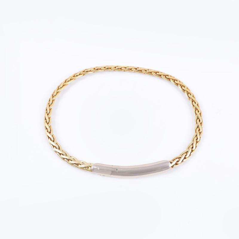 Pomellato, Bracciale pomellato in oro bianco e giallo 18 kt a maglia spiga
