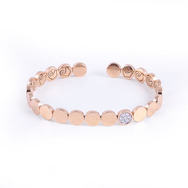 * 18KT GOLD SEMI-RIGID BRACELET SET WITH DIAMONDS AND TITANIUM INTERNAL SPRING, BY CHANTECLER "Paillettes"