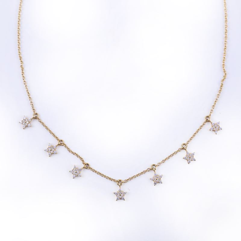 Dámaso Martínez, CATENINA girocollo in oro giallo 18 kt con pendenti a forma di stella e brillant...