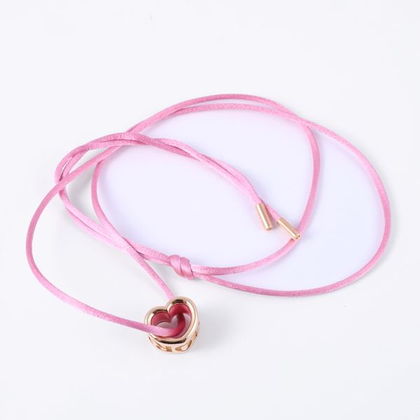 * 18KT GOLD PENDANT WITH PINK ENAMEL, SUSPENDED FROM A MATCHING PINK SILK CORD WITH 18KT GOLD TERMINALS, BY PASQUALE BRUNI "Amore"