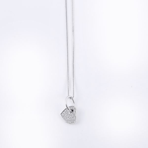 * 18KT GOLD LOT COMPRISING A DIAMOND-SET PENDANT AND A 18KT GOLD CHAIN