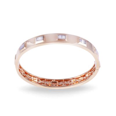 Bracciale rigido in oro rosa 18 kt con brillanti e diamanti baguette