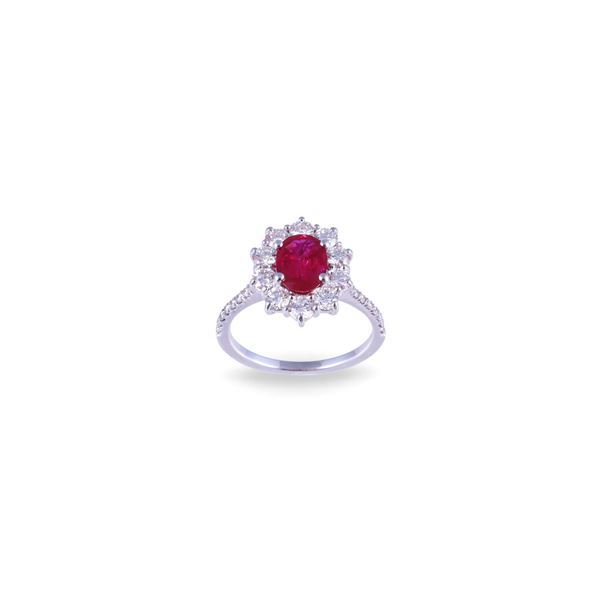 * 18KT GOLD RING SET WITH RUBY AND DIAMONDS
