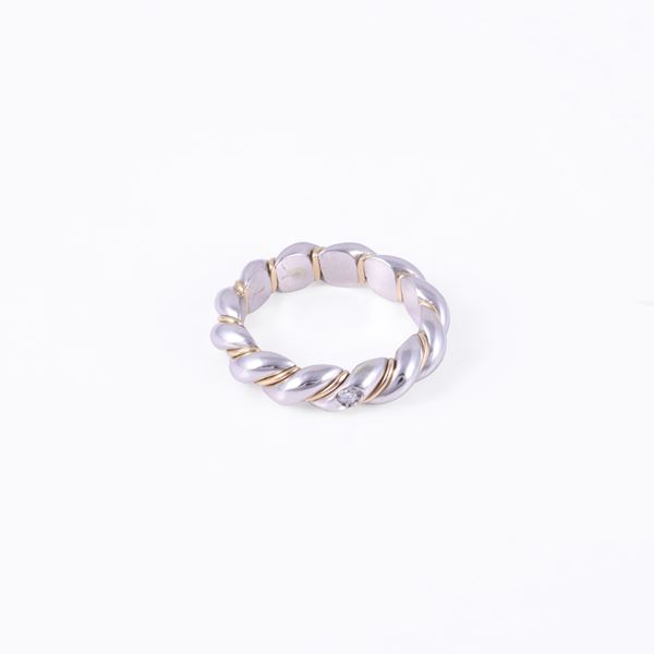 * PLATINUM AND 18KT GOLD RING SET WITH DIAMOND