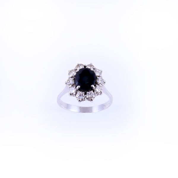 18KT GOLD RING SET WITH SAPPHIRE AND DIAMONDS