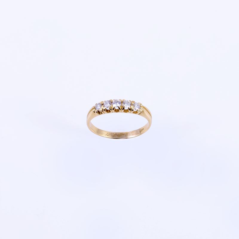 Anello a rivière, oro giallo 18 kt con brillanti