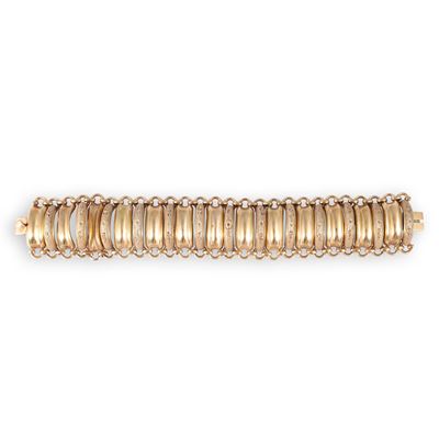 Bracciale, oro giallo 18 kt a fascia con elementi bombati costolati e motivi floreali