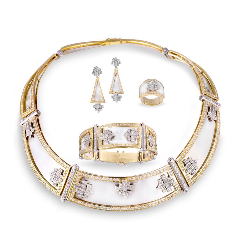 Parure, gioielli in oro bianco e giallo 18 K con brillanti