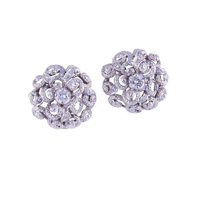 Orecchini a clip in oro bianco 18 kt, motivo a rosone con brillante e piccoli diamanti